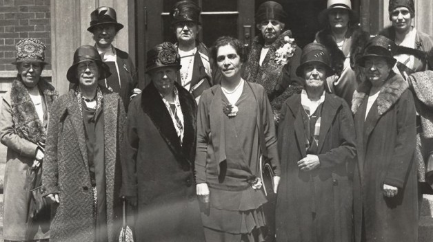 black and white photo of eleven women