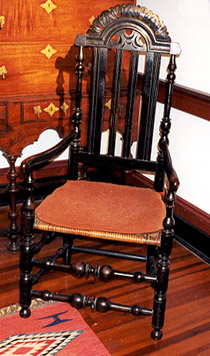Banester-back armchair with carved arch seat