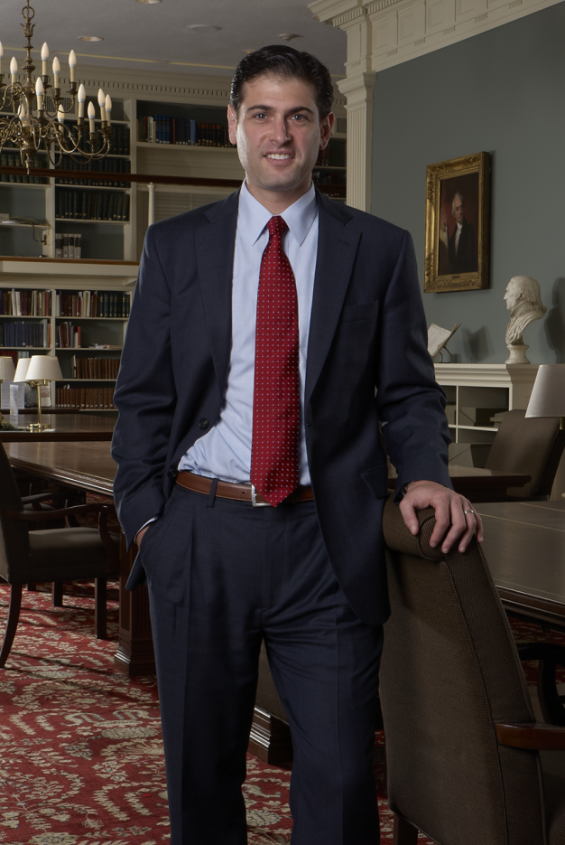 portrait of Patrick Spero, standing in APS Library reading room