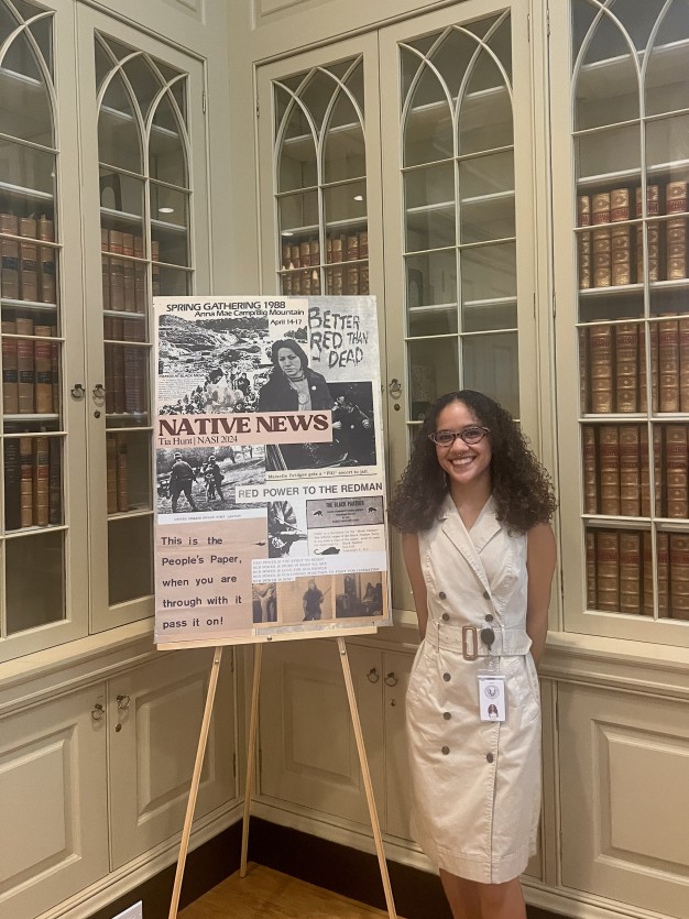 photo of Tia with her research poster