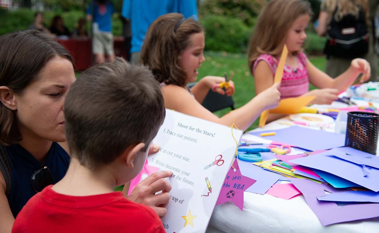 Families doing crafts in APS's Jefferson Garden 